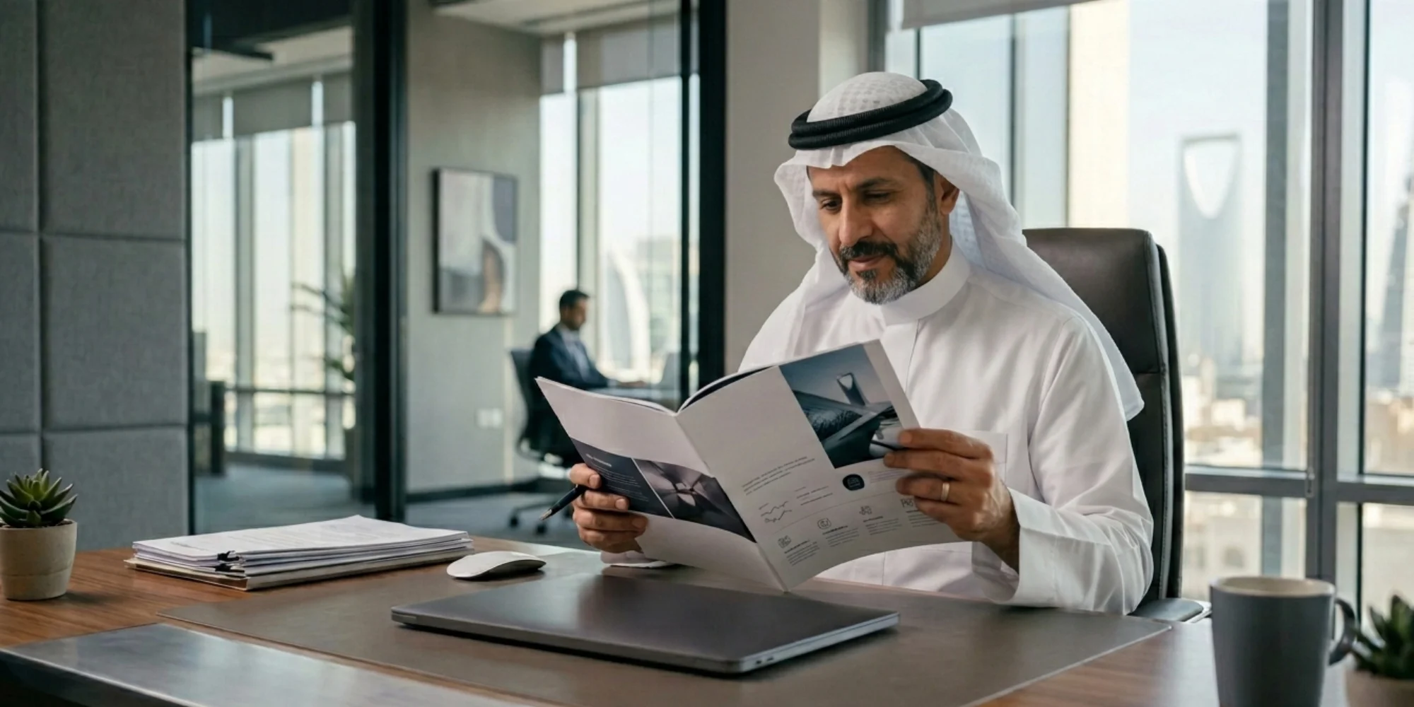 businessman reviewing company profile design in modern Riyadh office